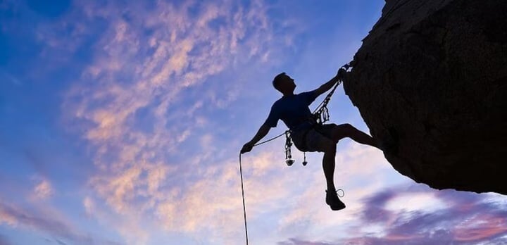 A person climbing a rock